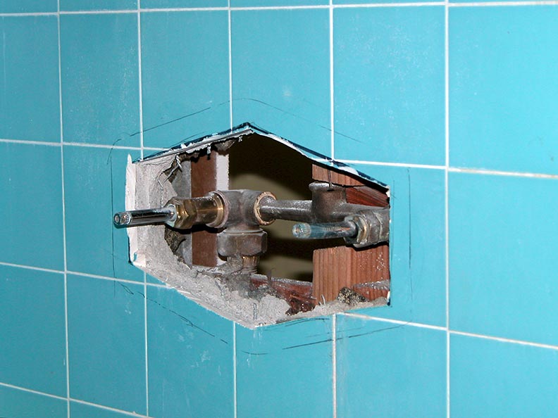 Front tile cut demo showing old Tub Shower diverter Valve for Single Handle ADA Tub Shower mixer